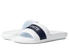 Lacoste Croco Slide 0721 1 - Men's Shoes : White Navy : Stay comfortable in the Lacoste Croco Slide 0721 1 featuring a classic slip-on style slide boasting branding center strap. Textile and synthetic upper. Textile lining. Synthetic insole and outsole. Imported. Measurements: Weight: 8 oz Product measurements were taken using size 9, width M. Please note that measurements may vary by size. Weight of footwear is based on a single item, not a pair. Classic Synthetic Slides, Classic Synthetic Slides With Branded Insole, Classic Slip-on Synthetic Slides, Classic Synthetic Slip-on Slides, Sporty Slides With Rubber Sole, Mens Lacoste, Air Shoes, Nike Air Shoes, Shoes White