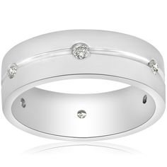 a white gold wedding ring with three diamonds