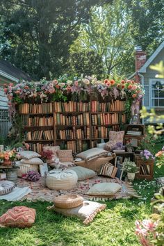 a book shelf filled with lots of books on top of a lush green field covered in flowers