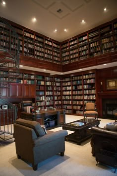 a living room filled with lots of furniture and bookshelves next to a fire place