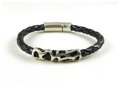 "Unique mens jewelry boho chic braided bracelet in black genuine leather. Features a beautiful tribal antiqued silver tube bead, and a secure tube shaped magnetic silver clasp. Made from 5 mm round braided leather and Sterling silver Zamak hardware, that's hypoallergenic, certified lead and nickel free. A stylish silver and leather bracelet for him (or for her) that's made to fit in the size you select from the drop down menu. **EASY SIZING: Wrist size (measured without slack) + wiggle room (1/4 Casual Silver Jewelry With Black Band, Handmade Black Leather Braided Bracelet, Black Handmade Braided Bracelets For Everyday, Bohemian Leather Braided Bracelet As Gift, Bohemian Braided Leather Bracelet Gift, Bohemian Black Braided Bracelets, Black Bohemian Bracelet, Adjustable Nickel-free Black Leather Bracelet, Handmade Modern Black Braided Bracelets