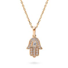 a gold hamsa necklace with diamonds on it