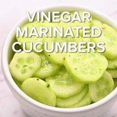 a white bowl filled with sliced cucumbers