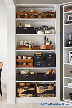 an organized pantry with bins and baskets