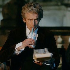 the doctor who is drinking from a cup