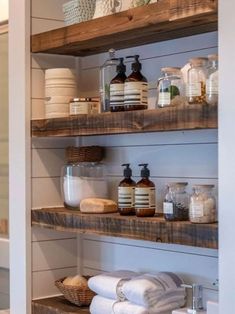 the shelves in this bathroom are filled with various items