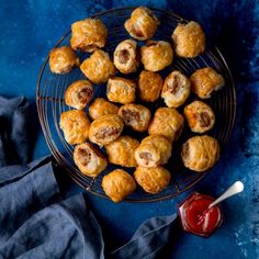 some food is on a wire rack next to a blue cloth