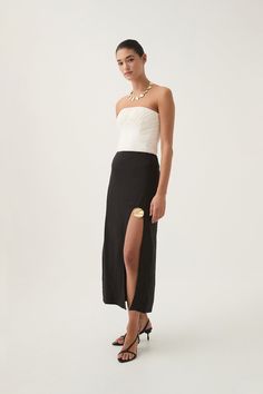 Adelaide Midi Skirt | Black | Aje – Aje ROW Chic Party Maxi Skirt With Split Design, Elegant Split Maxi Skirt With Lined Detail, Elegant Split Maxi Skirt With Lining, Elegant Split Maxi Skirt For Party, Chic Split Maxi Skirt For Evening, Chic Evening Maxi Skirt With Split, Elegant Midi Skirt With Split Design, Chic Evening Draped Pencil Skirt, Elegant Split Skirt For Party