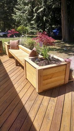 a wooden bench sitting on top of a wooden deck