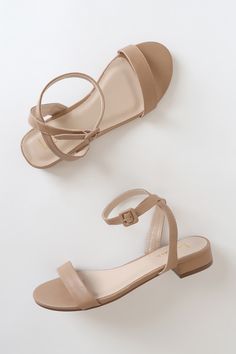 Lulus Exclusive! The Lulus Darryian Light Nude Ankle Strap Sandals add the perfect amount of chic to any look! Sleek vegan leather shapes these versatile sandals that have a slender toe strap and matching ankle strap with a square buckle. Low block heel adds just the right amount of height! 1" wrapped block heel. Lightly cushioned insole. Rubber sole has nonskid markings. Man Made Materials. Imported. Lulus | Darryian Light Nude Ankle Strap Sandal Heels | Size 5 | Beige | Vegan Friendly. Nude Sandals Flat, Bridesmaid Shoes Flat, Bridesmaid Sandals, Bridesmaids Shoes, Heels Beige, Womens Trendy Dresses, Dressy Sandals, Ankle Strap Sandals Heels, Nude Sandals