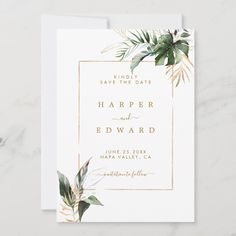 an elegant wedding save the date card with greenery and gold foil on white paper