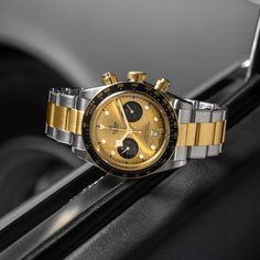 This is a Tudor BlackBay Chrono model wristwatch. It features a 41mm stainless steel case, a 70-hour power reserve, a yellow gold screw-down crown, a fixed yellow gold bezel with a black aluminum disc, a champagne dial with black counters, and a domed sapphire crystal. The watch is completed by a stainless steel and yellow gold bracelet. Five-year Guarantee: Five-year transferable guarantee with no registration or periodic maintenance checks required Case: 41mm stainless steel case with a polish Luxury Chronograph Watch In Yellow Gold With Metal Dial, Modern Yellow Gold Automatic Chronograph Watch, Timeless Yellow Chronometer Watch, Timeless Yellow Watch With Chronometer, Luxury Yellow Watches With Subdials, Luxury Yellow Watch With Subdials, Yellow Chronograph Watch For Formal Occasions, Luxury Yellow Watch Accessories With Round Dial, Formal Yellow Chronograph Watch