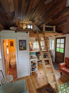 a loft with stairs leading up to the bedroom