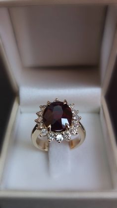 Ruby -Diamonds gold ring Weight of the ring: 9.00 grams ADDITIONAL STONES Stone Type: 100% Natural Diamonds Shape: Round Brilliant Carat Weight: 0.70 Ct Color: G-H Clarity: VS2 Cut: Excellent MAIN STONE Type: Lab Created Red Ruby Size: 5.00 Carat Shape: Oval Color: Red Clarity: Fine Quality (SI) Ring Size: 6.5 Size Selectable (4-9 US sizes) Materials: 18k,yellow,rose gold,white gold Exquisite Oval Ruby Ring In White Gold, Luxury Oval Ruby Ring For Anniversary, Formal Oval Ruby Ring With Center Stone, Oval Ruby Ring With Diamond Halo, Exquisite Oval Halo Ring For Formal Occasions, Oval Cluster Ring With Halo Setting For Formal Events, Formal Oval Cluster Ring With Halo Setting, Formal Oval Cluster Ring With Gemstone, Oval Cluster Ring With Gemstone For Formal Occasions