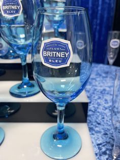 blue wine glasses sitting on top of a table