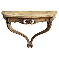 a wooden table with carvings on the top and bottom, sitting against a white background