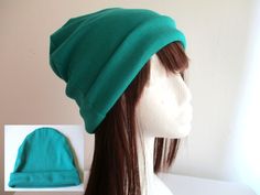 a mannequin head wearing a green hat