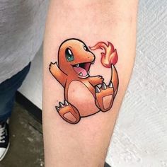 a person with a pokemon tattoo on their arm