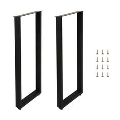 two black metal doors with screws and nails