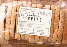 some bread that is wrapped in plastic on a piece of paper with a business card