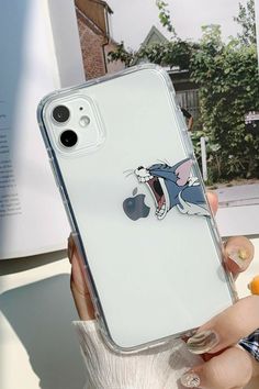 a person holding up an iphone case with the cartoon mouse on it