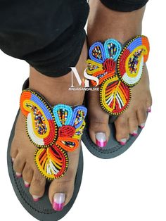 100% handmade using leather and fine beads. Masai beaded sandals are made using the pure original leather and quality African beads.They are inspired by the Masai community They are perfect for any occasion. True to size. We ship worldwide. Feel free to send me a convo for any clarifications Handmade Casual Open Toe T-strap Sandals, Multicolor Toe Post Flip Flops For Vacation, Handmade Adjustable Sandals For Party, Beaded Round Toe Sandals For Beach, Beaded Toe Post Sandals For Beach, Beaded Toe Post Sandals For Vacation, Multicolor Open Toe T-strap Sandals, Traditional Handmade Adjustable Sandals, Adjustable Multicolor Open Toe Flip Flops