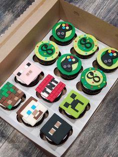 a box filled with cupcakes decorated to look like video games