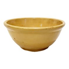 a yellow ceramic bowl on a white background