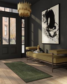 a living room filled with furniture and a chandelier hanging from the ceiling over a wooden floor