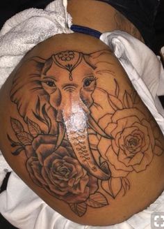 an elephant with roses on it's stomach is shown in this tattoo design by the artist