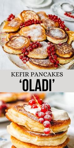 pancakes are stacked on top of each other with berries and powdered sugar in the middle