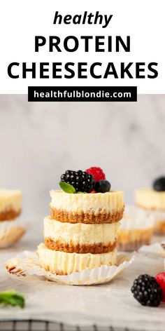 healthy protein cheesecakes stacked on top of each other with berries and raspberries