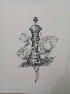 a pencil drawing of a candle with roses on the side and a cross in the middle