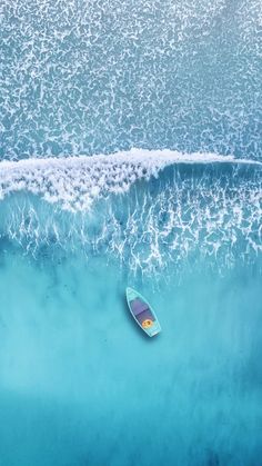 an aerial view of a surfboard in the ocean