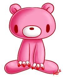 a pink teddy bear sitting on the ground