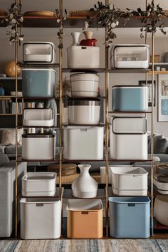 a room filled with lots of different types of storage containers and bins on shelves