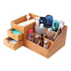 an open wooden drawer containing cosmetics and personal care items