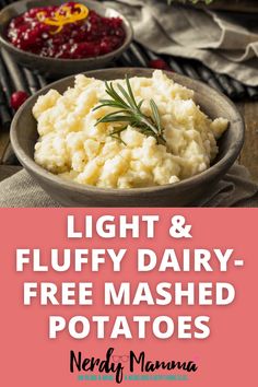 mashed potatoes in a bowl with cranberry sauce and rosemary sprig on top