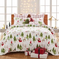 a christmas themed bed with presents on the floor