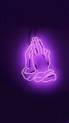 a purple neon sign that has a praying hand on it in front of a black background