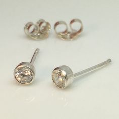 Small diamond cz stud earring.  Great for cartilage piercings.Metal: 925 Sterling SilverStone: White diamond CZSize : diameter 4mm  Other sizesLargehttps://www.etsy.com/listing/398208557Mediumhttps://www.etsy.com/listing/72270182Store home pagehttp://www.etsy.com/shop/360JewelsThanks for your interest in our men's diamond cz stud earrings. White Gold Single Diamond Piercing As A Gift, Silver Nose Studs With Prong Setting Gift, White Gold Piercings With Single Diamond As Gift, Classic Round Cut Piercings As Gift, Sterling Silver Piercings In Diamond White As Gift, Diamond White Piercings With Prong Setting For Gift, Classic Silver Piercings With Prong Setting, Classic Silver Diamond Piercings, Classic Round Nose Studs For Gifts