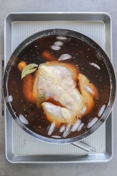 a pan filled with food on top of a table