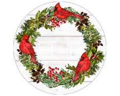 a red bird sitting on top of a wreath with pine cones and holly branches around it