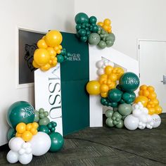 some balloons are in the shape of an arch