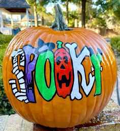 a pumpkin with the word look painted on it