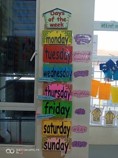 a bulletin board with days of the week written on it