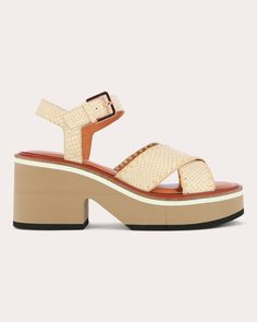 Crafted from snake-embossed leather, the Charline sandal features wide, crossover straps that create a feminine shape on the foot. The platform sole balances a chunky look with a lightweight construction for comfortably elevated appeal. Buckle closure Snake-embossed straps Stitched strap trim Upper: 100% goat leather Lining: 100% lamb leather Outsole: 100% elastomer Clean with soft brush Made in France Size & Fit Heel height: 2.9in Platform height: 1.6in Fits true to size The Platform, Goat Leather, Platform Sandals, Embossed Leather, Made In France, Heel Height, Buckle, Sandals, Heels