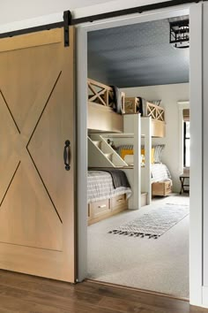 an open door leading to a bedroom with bunk beds