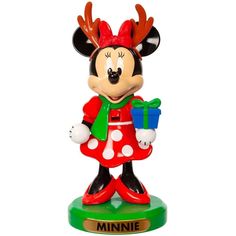 a minnie mouse figurine holding a present