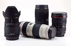 three camera lens cups sitting next to each other